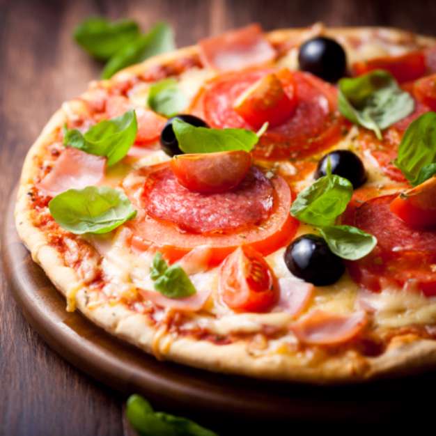 Pizza with salami, tomatoes and olives