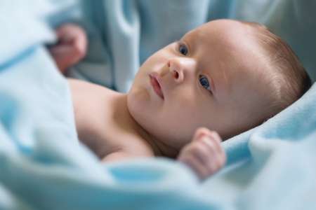 Smiling beautiful newborn