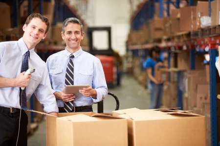 Businessmen Checking Boxes With Digital Tablet And Scanner