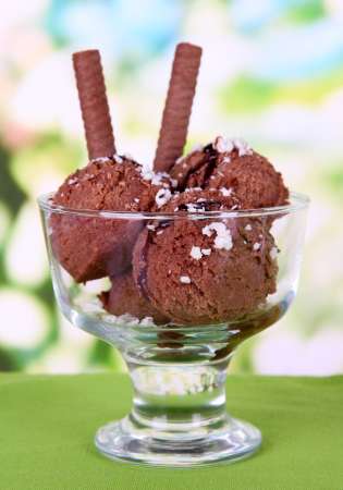 Delicious ice cream on table on bright background