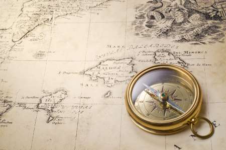 old compass and rope on vintage map 1732