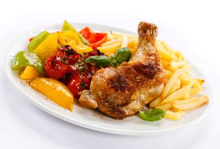 Grilled chicken leg, chips and vegetables