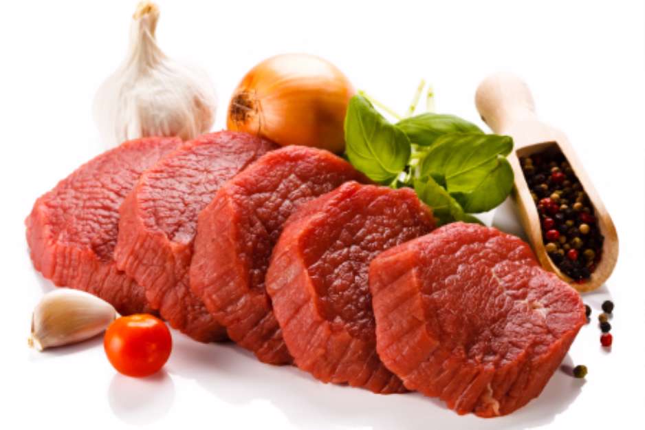 Raw beef and vegetables on white background