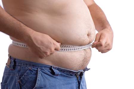 fat man holding a measurement tape