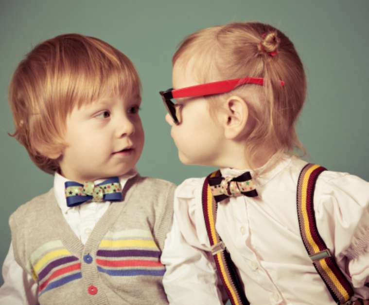 Vintage girl and boy on a green background.