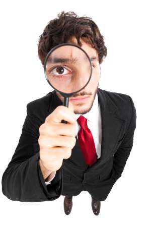 Business man with magnifying glass