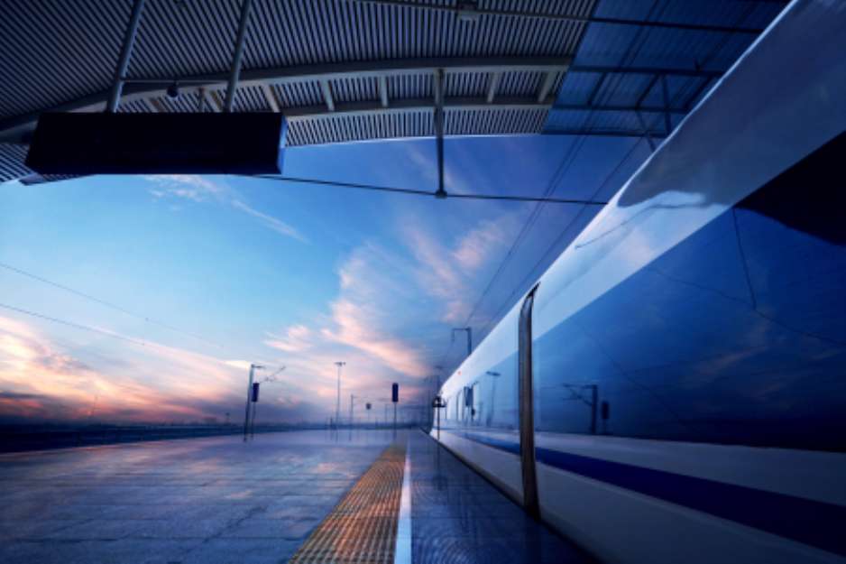 train stop at railway station with sunset