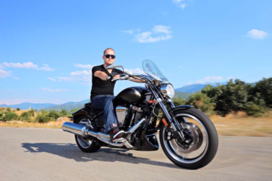 A young biker riding a customized motorcycle