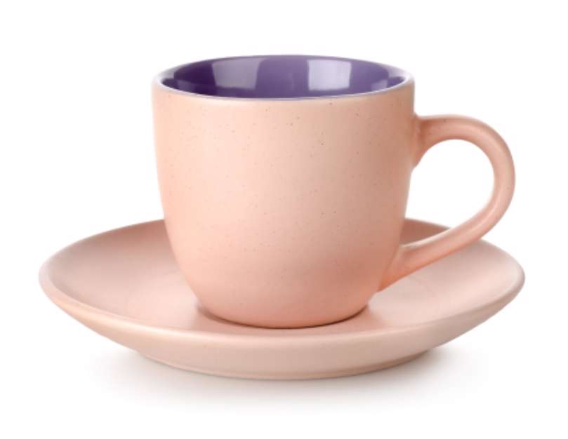 Pink cup and saucer isolated