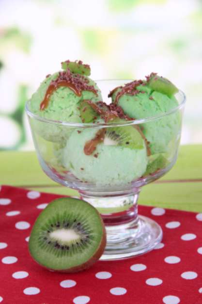 Delicious ice cream on table on bright background