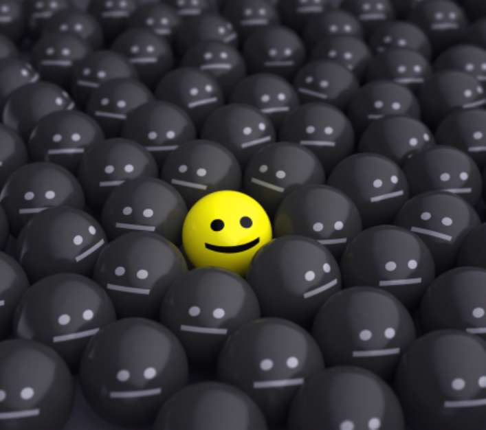 smile in the middle of grey crowd