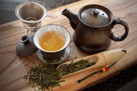 Cup of green tea and accessories