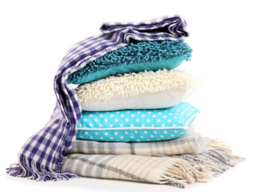 Hill colorful pillows and plaids isolated on white