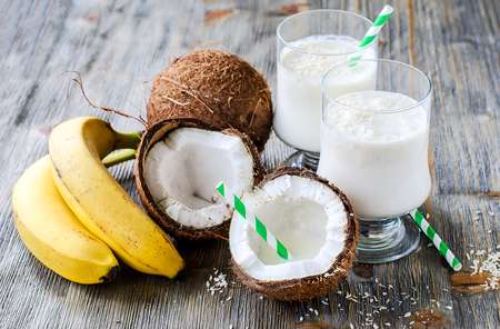 Fresh sweet healthy coconut milk shake with bananas 