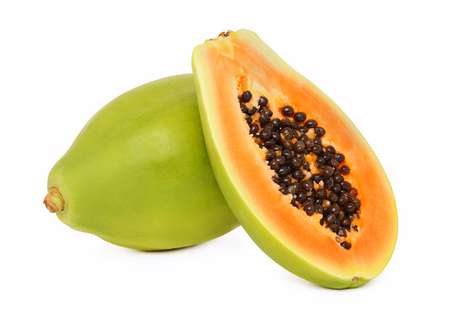 One whole and a half ripe papaya isolated on white background