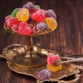 Colorful fruit candy in sugar in the form of hearts