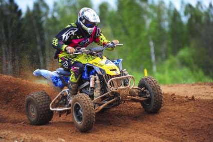 PLUNGE,LITHUANIA-MAY 11:Unidentified rider in action in Lithuanian Open Motocross Championship 2012 first roundon May 11,2012 in Plunge, Lithuania.