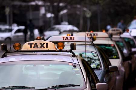 Taxi rank lineup, shallow focus, desaturated background